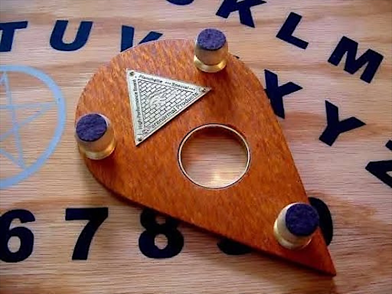 The pointer planchette on a board
